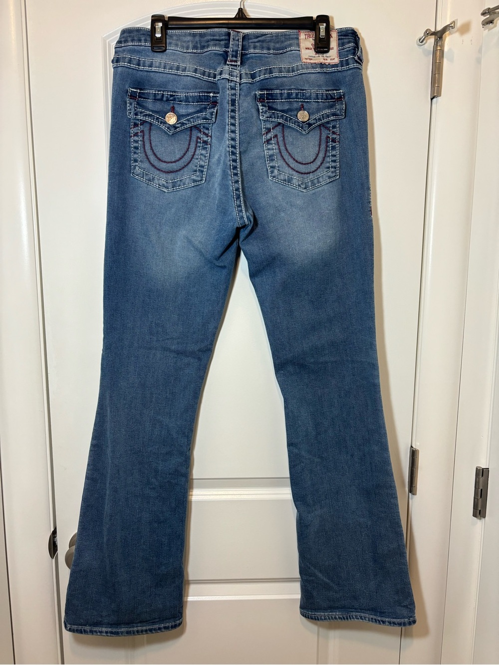 True Religion Medium Blue Flare Jeans with Signature Back Pockets